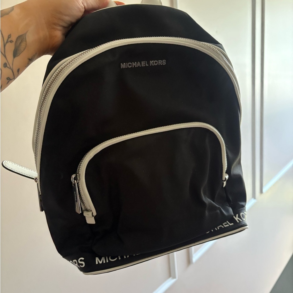 Michael Kors Black and White Backpack with Structured Design